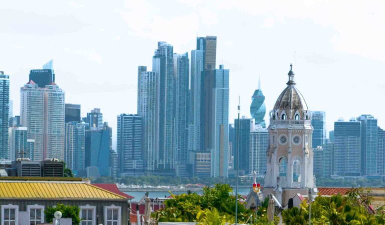 View of Casco Viejo rooftops and the Metropolitan Cathedral tower with Panama City’s modern skyline in the background